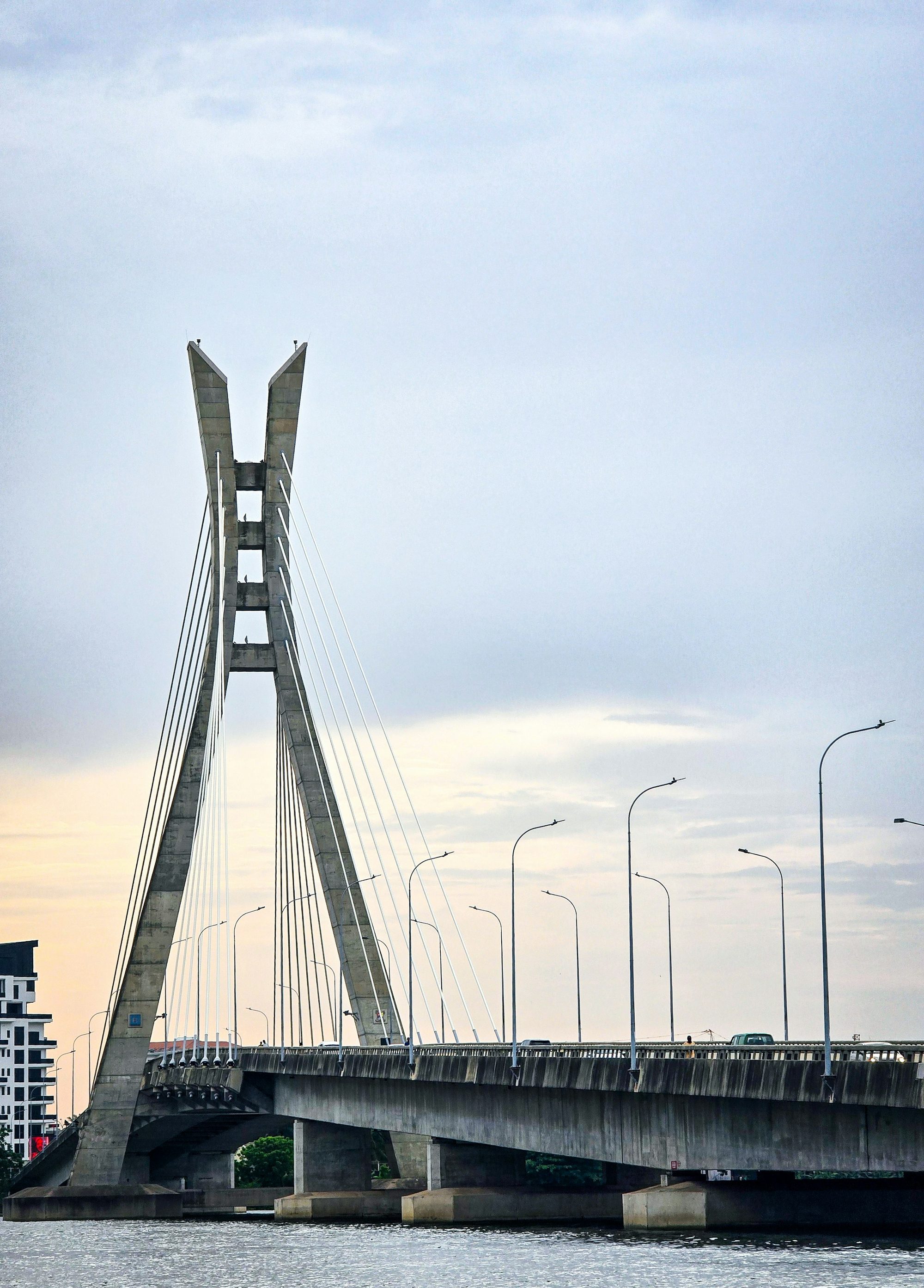 The Lekki-Ikoyi Link Bridge against a pale Lagos sky