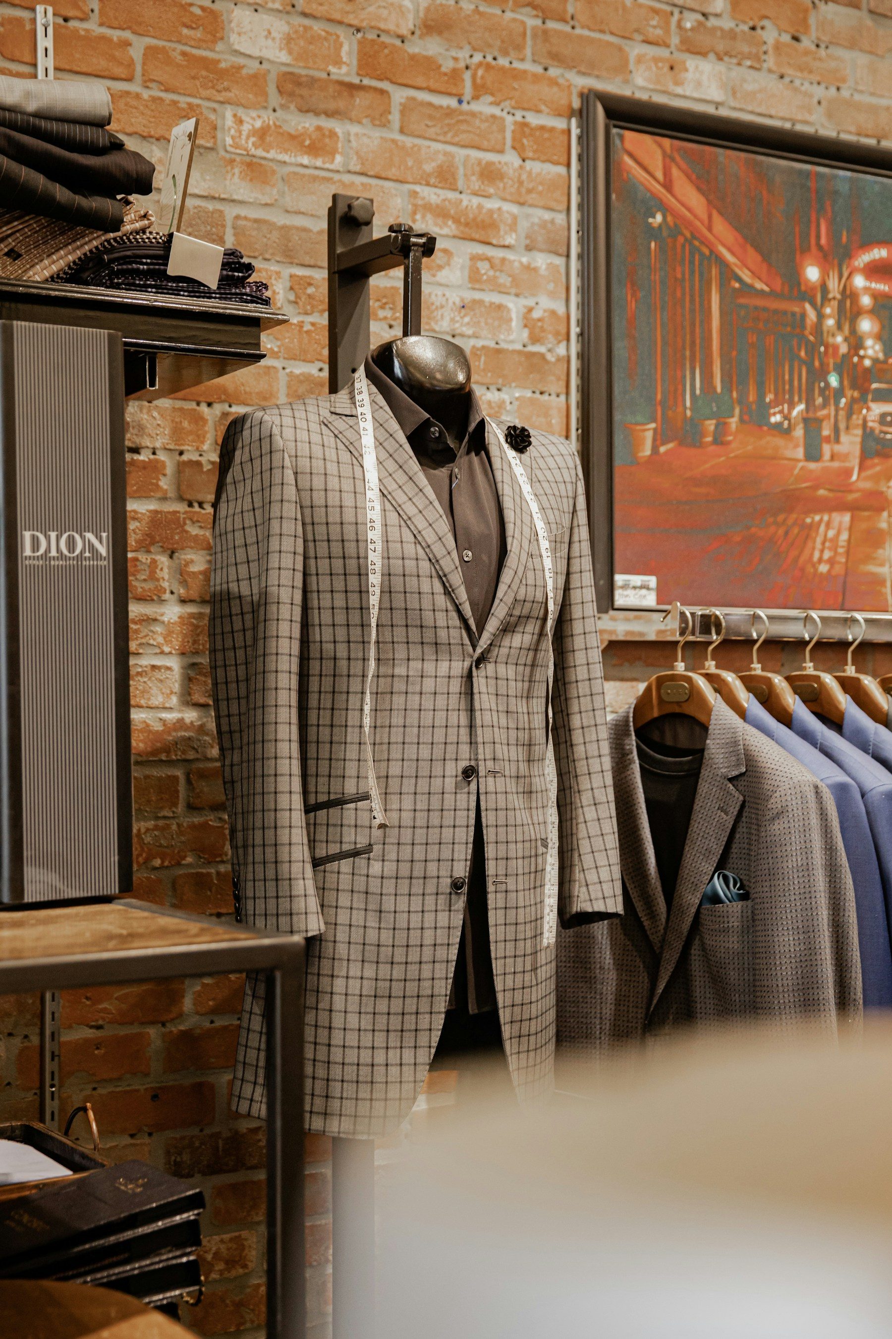 A checked suit jacket on a mannequin in a tailoring shop