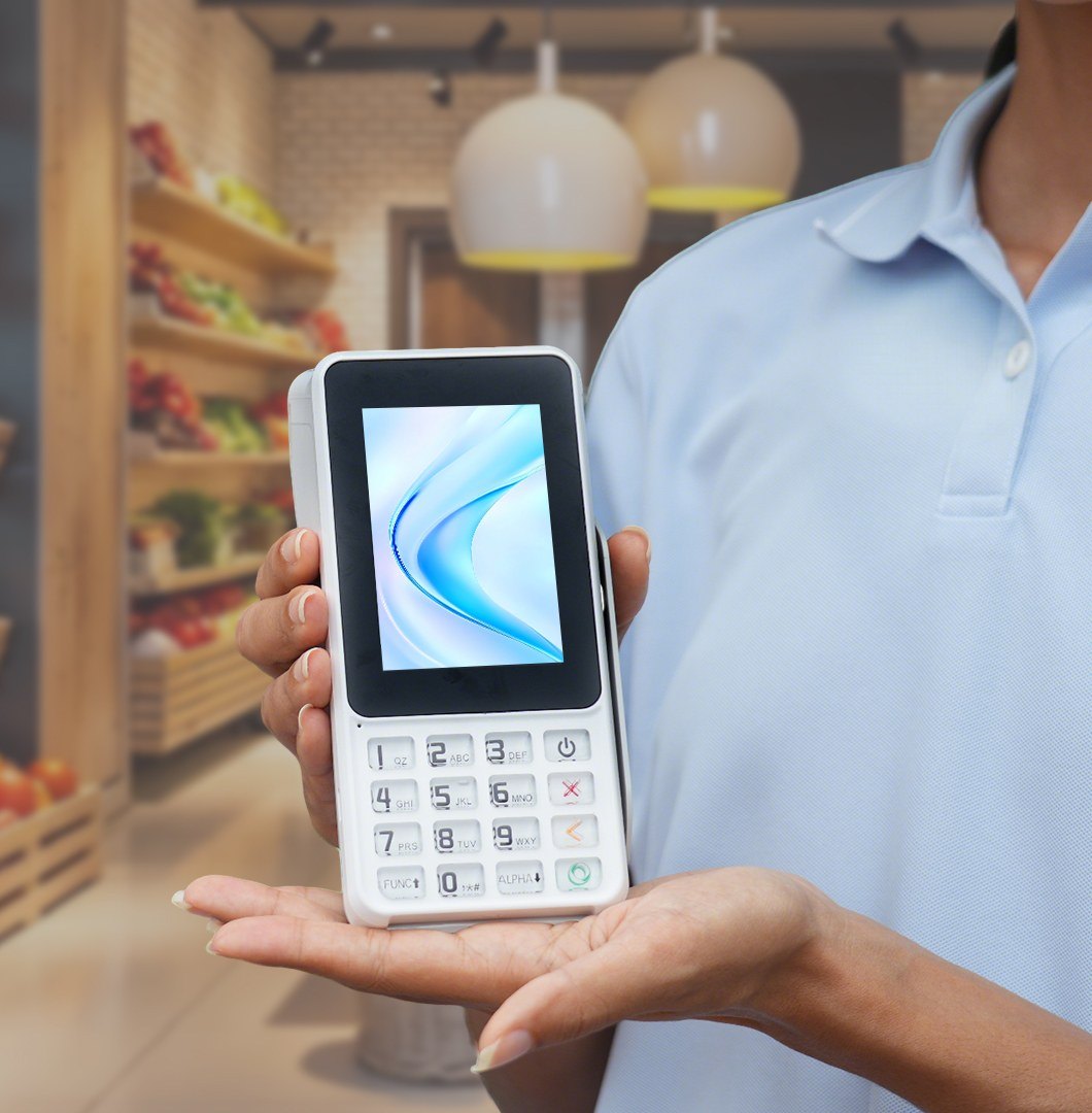 The CSwitch POS terminal held out in a shop